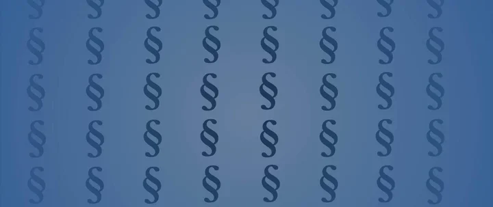 Niebieskie tło z powtarzającym się wzorem znaku paragrafu ułożonym w regularną siatkę.